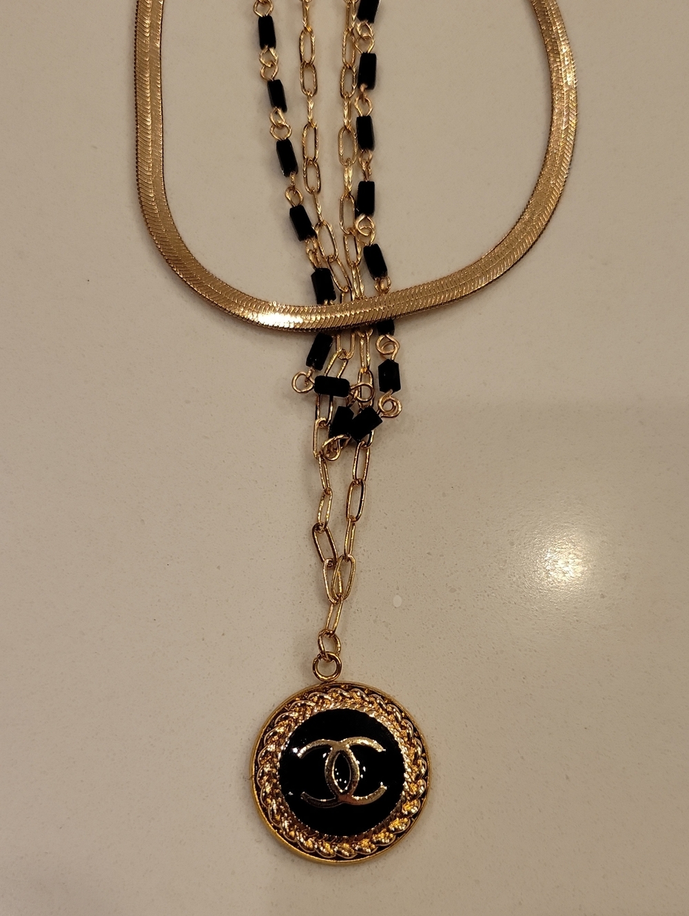 New Layered CC Necklace In Gold And Black